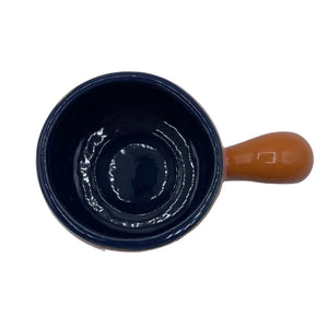 Clear top-down view of Bloc Cup’s navy interior and glossy finish with terracotta handle.