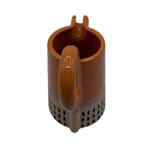 Back view of Bloc Jug showing circular handle and vertical navy dot detailing.