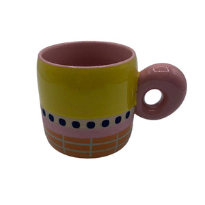 Studio product shot of Bloc Mug with glossy finish and graphic dot detailing.