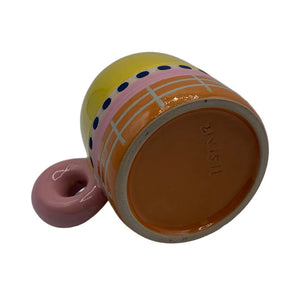 Underside view of Bloc Mug showing terracotta base and hand-painted grid pattern.