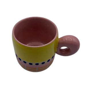 Top-down view of Bloc Mug highlighting pink glazed interior and bold circular handle.