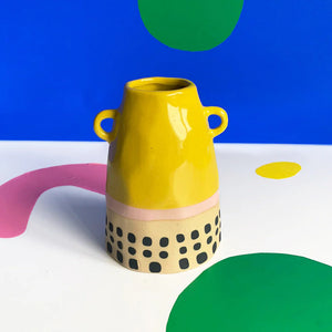 House of Disaster Bloc Yellow Vase with peach rim and blue base on white background.
