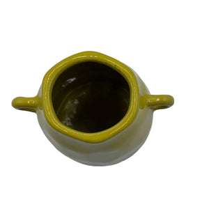 Angled shot of Bloc Yellow Vase highlighting vibrant yellow body and colour contrast.