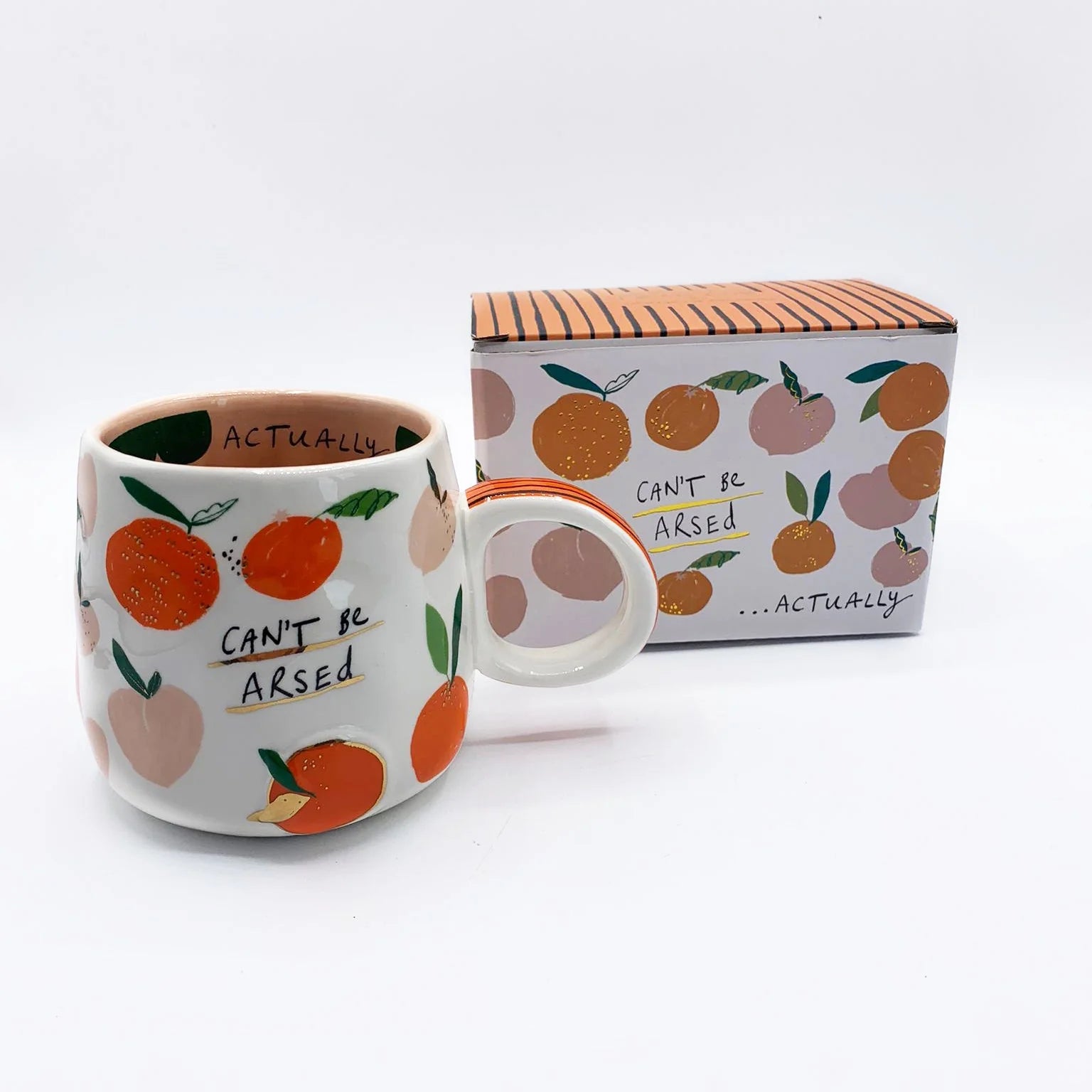 Peach-themed ceramic mug with “Can’t Be Arsed” text, displayed next to its matching peach-patterned gift box with the full message “…Actually”.