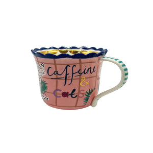 Side profile of ceramic Catnip Cat Cup showing striped handle and playful feline design.