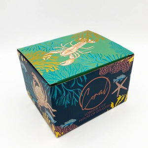 Gift box for Coral Lobster Cup, decorated with underwater illustrations including coral, crabs, and a lobster, with metallic gold accents.