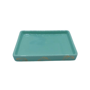 Empty mint green porcelain butter dish base featuring gold ginkgo leaf detailing around the sides, shown on a white background.