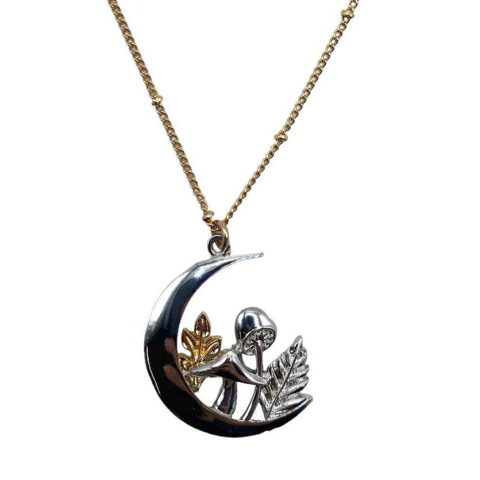 Studio shot of the Forage Moon Necklace with clear white background, showcasing silver crescent pendant and gold-tone chain in full detail.