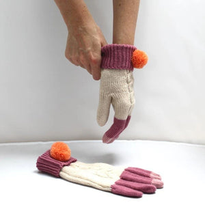 Loop Cream Gloves in cream and berry wool blend, orange pom-poms on cuffs, shown being worn and displayed flat.