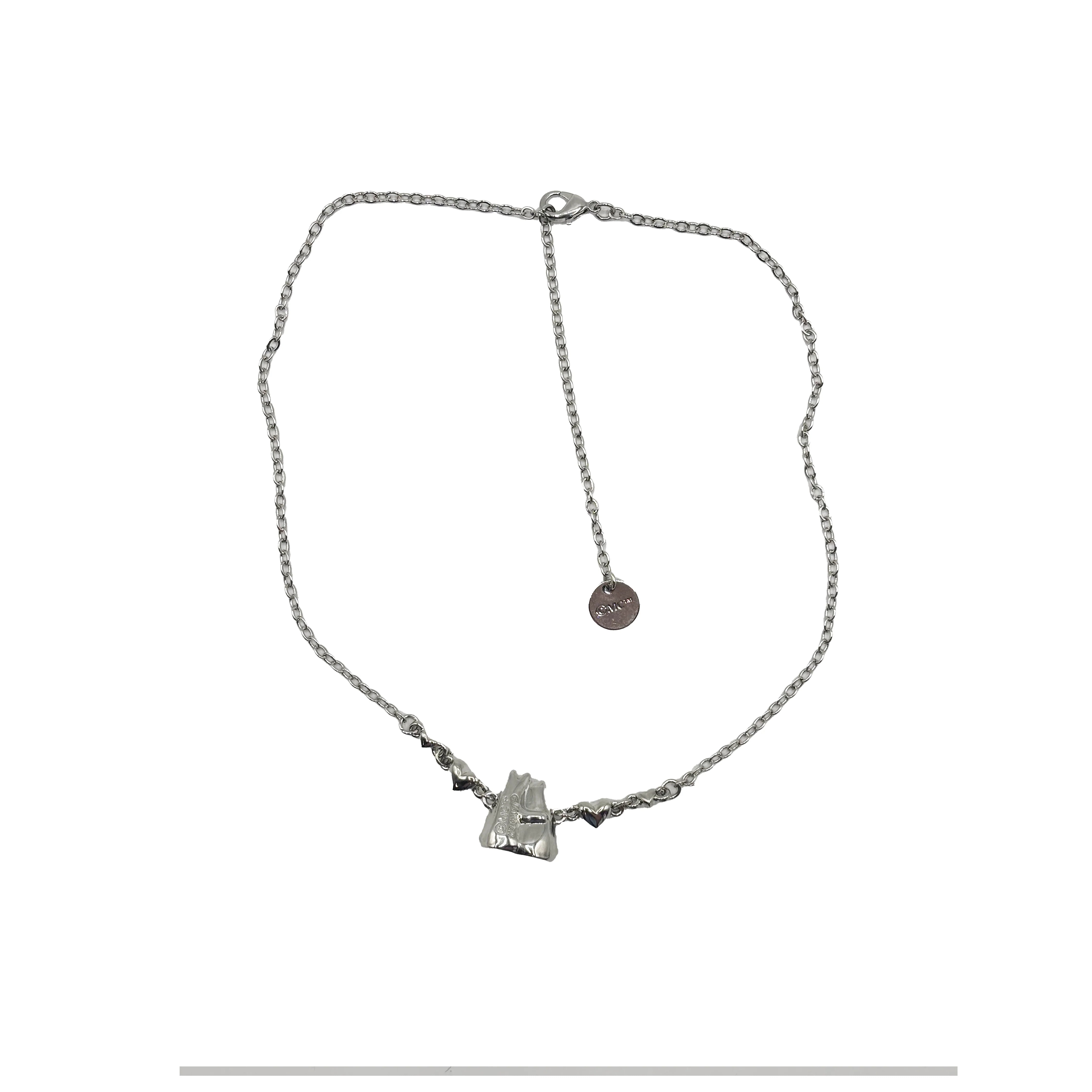 Flat lay of Moomin Love Necklace with silver chain and clasp showing full length.