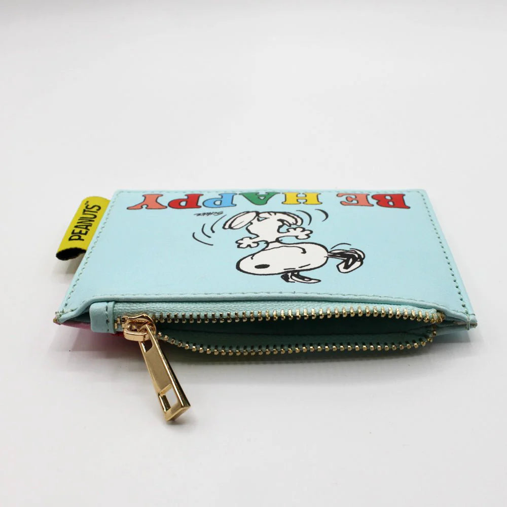 Flat lay of Snoopy ‘Be Happy’ purse showing zipper detail and Peanuts tag.