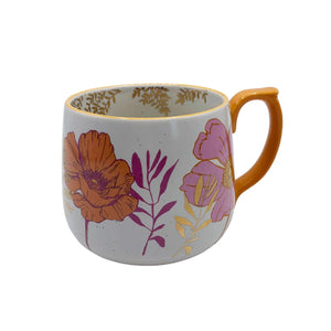 Front-facing image of Posy Orange Mug – floral ceramic cup with bold flower design and vibrant orange handle.
