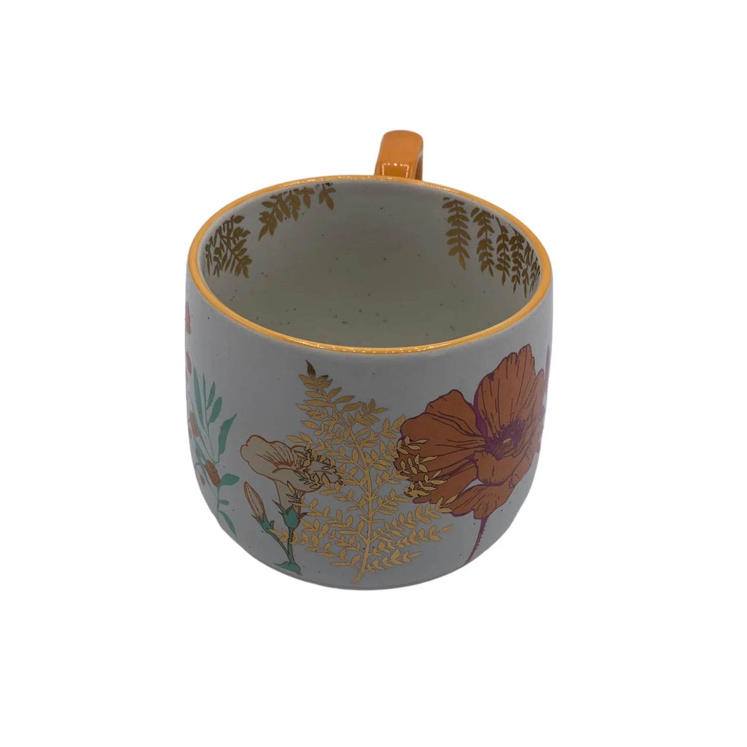 Angled view of Posy Orange Mug showing inner gold foil foliage – ceramic mug with floral details and rustic finish.