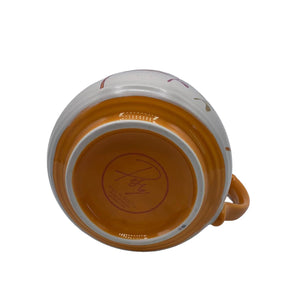 Base of Posy Orange Mug showing orange bottom and brand stamp – close-up of ceramic floral cup from House of Disaster.