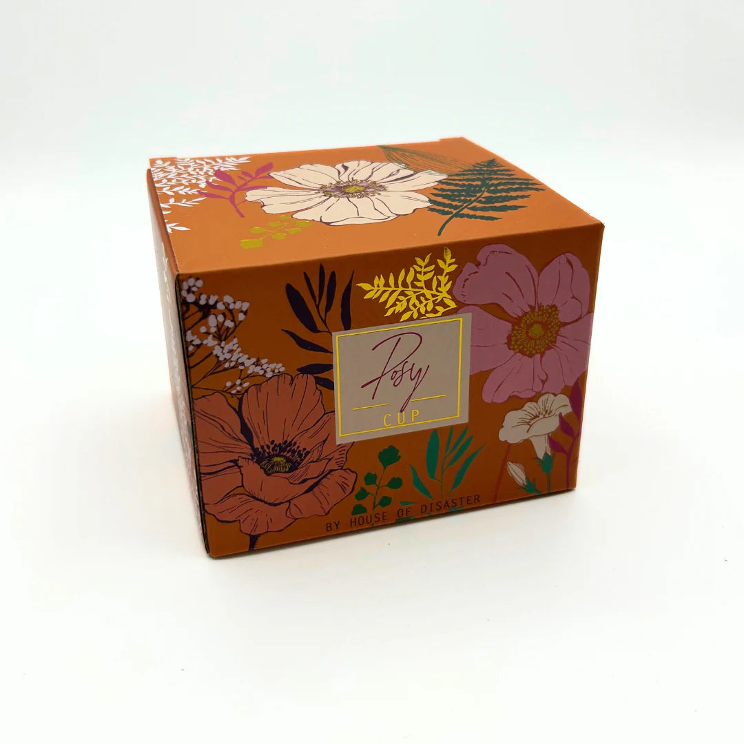 Decorative packaging for Posy Orange Mug – floral gift box with orange background and flower illustrations.