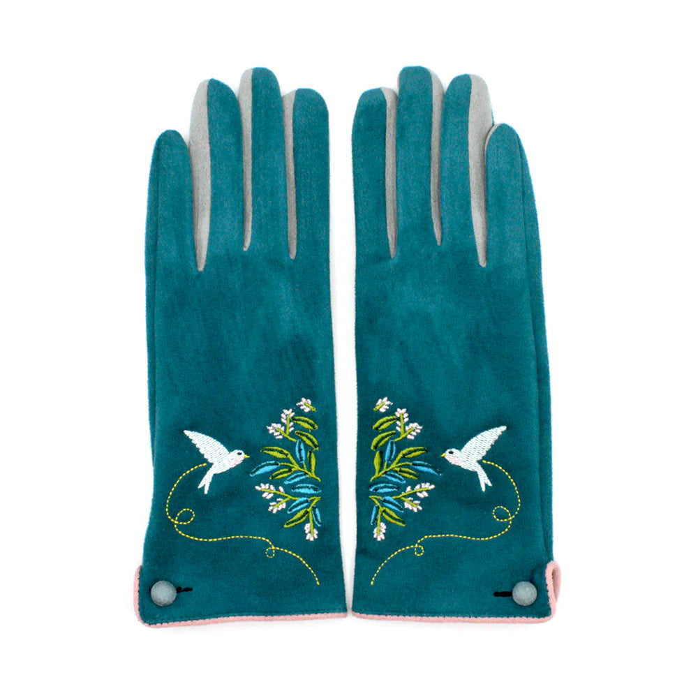 Top-down view of both teal gloves laid flat, featuring mirrored bird and foliage embroidery on the wrists.