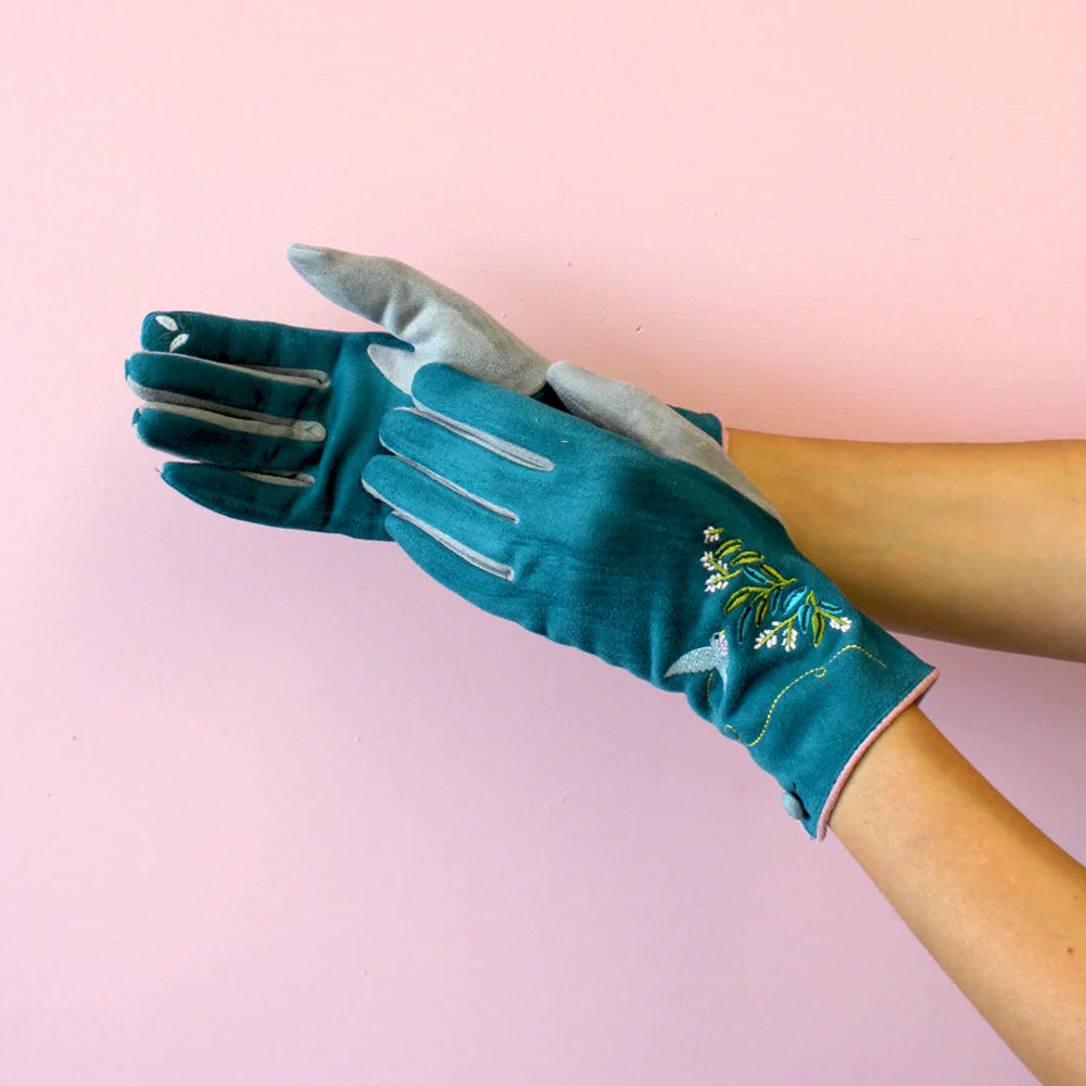 Model showing both sides of the teal embroidered gloves with contrasting grey touch-screen fingertips.