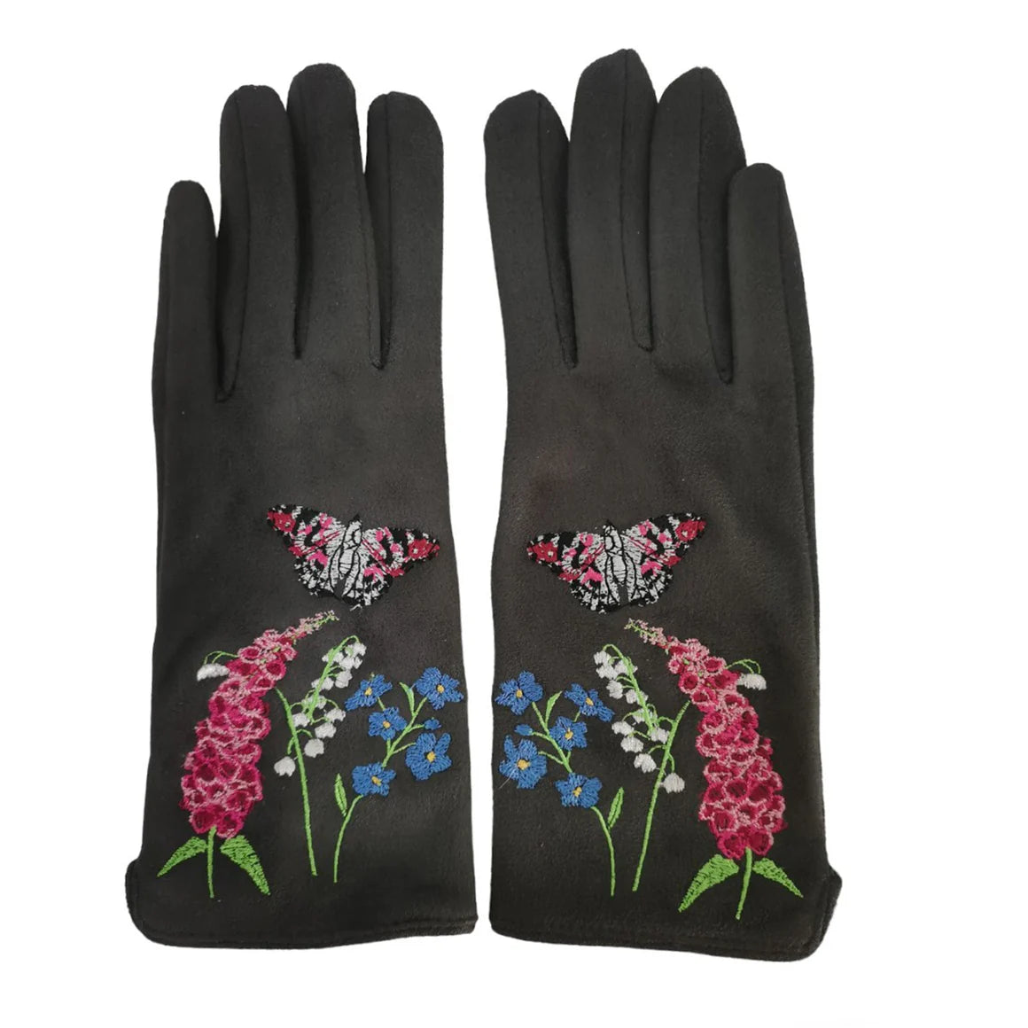 Flat lay of both gloves with vivid floral and butterfly embroidery on the outer side, including pink foxgloves, lily of the valley, cornflowers, and two pink butterflies.