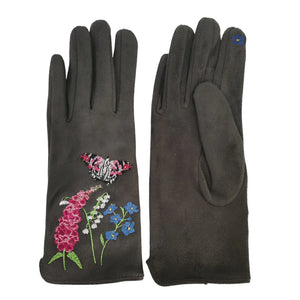 Flat lay showing one glove face-up with floral butterfly embroidery and the other face-down to highlight suedette texture and contrasting thumb touchscreen patch.