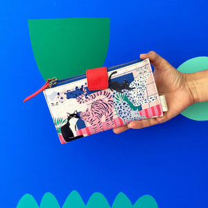 A person holding the House of Disaster Catnip Cat Wallet, showcasing its vibrant design.