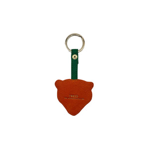 Back of tiger keyring with stitched orange PVC and “INKED” branding embossed in gold.