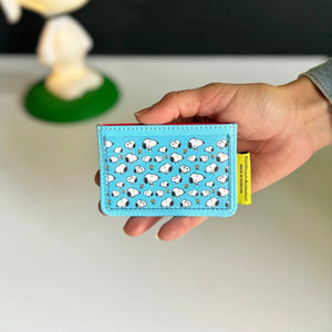 Back view of the Peanuts Bus Cardholder with an all-over Snoopy and Woodstock print.