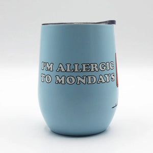 A straight-on view of the travel mug displaying the “I’m Allergic to Mondays” text on the light blue background.