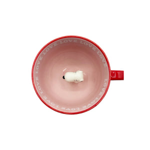 A top-down view of the Peanuts Love Mug, showcasing the 3D Snoopy figure sitting inside and the “LOVE” text around the rim.