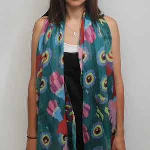 Model wearing the Yellow Submarine “Psychedelic” Scarf, showcasing its bold and colourful Beatles-inspired design.