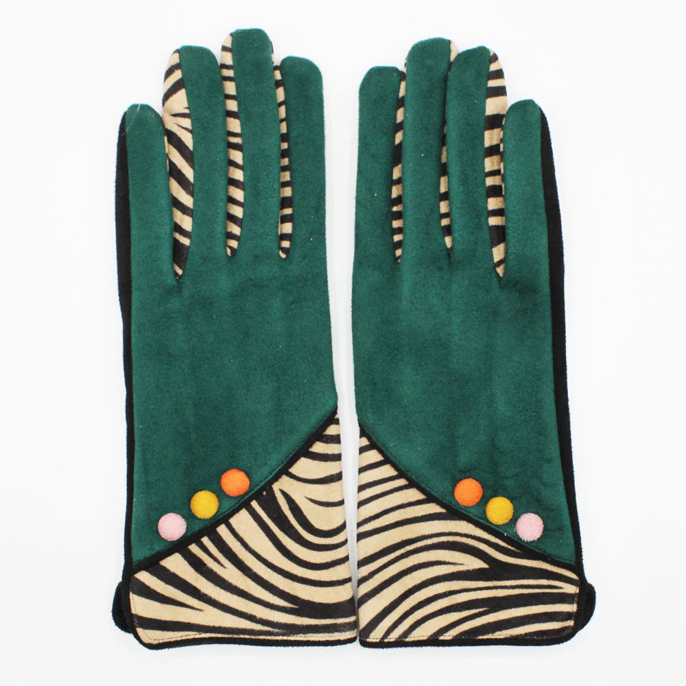 Flat lay of zebra print gloves with forest green fabric and colourful button accents on cuffs.