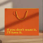 Orange If You Don't Want It I'll Have It gift bag on wooden table