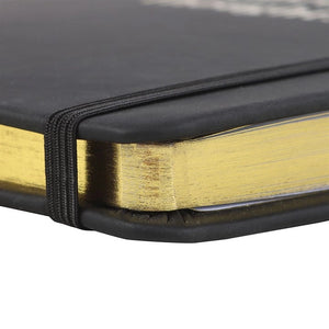 Detail of gold-edged pages and elastic band corner of the Inappropriate Thoughts Notebook – sleek and cheeky design.