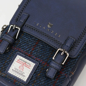 A close-up of the intricate navy over-check Harris Tweed fabric.