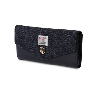 Ladies Harris Tweed clasp purse with a black PU leather body and finished with Black Herringbone patterned fabric. 