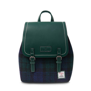 Ladies Harris Tweed backpack with a green PU leather body and a black watch tartan fabric. The Harris Tweed has a green and blue tartan pattern.