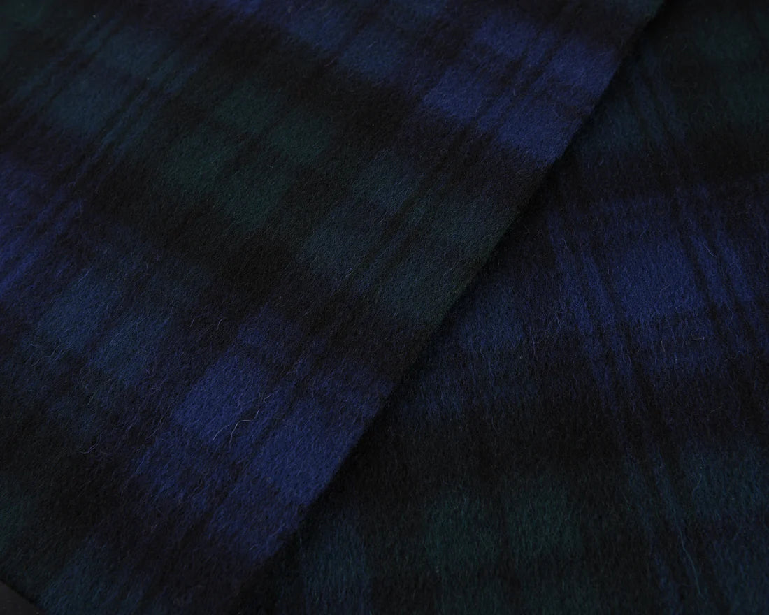Close-up of Black Watch Tartan Lambswool Scarf showing soft wool texture.