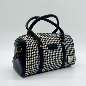 Side view of the Islander Black & White Dogtooth Duffel Bag in Medium Size.