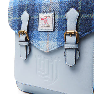 Close up image of the Harris Tweed backpack showing the fabric and the PU leather body. 