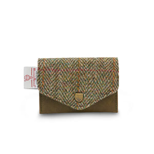 Front view of Islander Chestnut Herringbone Harris Tweed Card Holder with green leather base, classic tweed flap, metal crest, and official Harris Tweed tag.