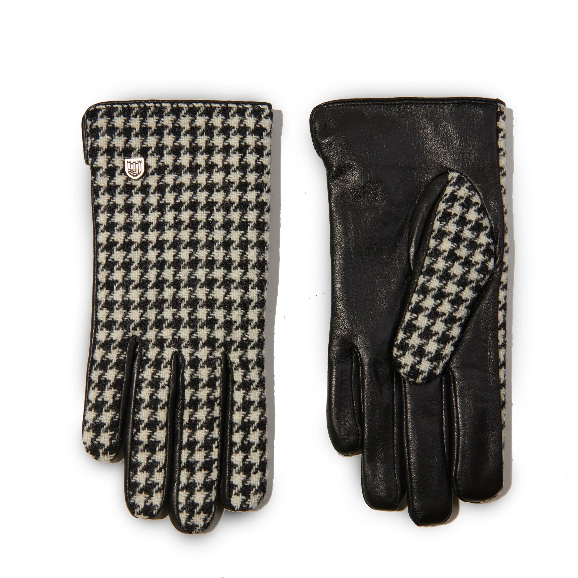 Front and back view of ladies black dogtooth Harris Tweed® gloves with leather palms and touch screen technology, handwoven in the Outer Hebrides.