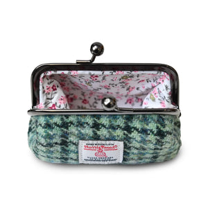 The coin purse open showing the floral internal lining.