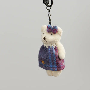 A pink and blue Harris Tweed Islander Bear Keyring, a feminine and playful accessory perfect for any occasion.