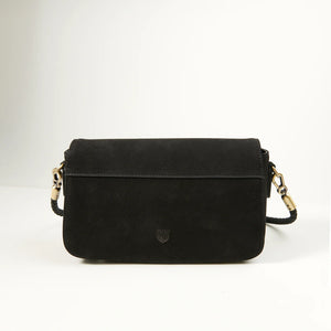 Rear view of Caithness Clutch Bag in black Harris Tweed® and leather, showcasing minimalist design, full-grain leather texture, and elegant finish.