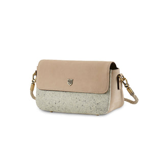 Angled view of the Islander Caithness Harris Tweed Clutch Bag in plain cream leather with textured tweed detail.