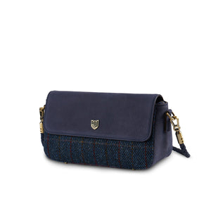 Angled view of the Islander Caithness Harris Tweed Clutch Bag showcasing navy over-check tartan and gold-tone hardware.