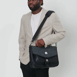 A professional man using a stylish Islander Harris Tweed laptop, perfect for work or travel.