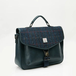 A side-angle view of a navy-over-check Harris Tweed laptop case, showcasing its shape and design.