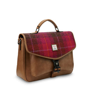 A side-angle view of a red tartan Harris Tweed laptop case, showcasing its shape and design.