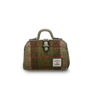 A mini doctor bag crafted from rich chestnut tartan Harris Tweed, featuring two top handles for versatile carrying. (Islander)