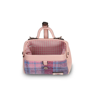 A look inside a charming mini doctor bag crafted from playful pink and blue tartan Harris Tweed, revealing its spacious interior perfect for organizing everyday essentials. (Islander)